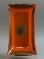 Georges Briard orange glass serving tray showing gilt border, curved form and dark wood handles.