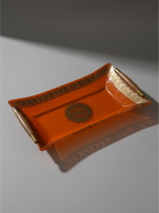 Signed Georges Briard orange glass serving tray with gilt border and dark wood handles.