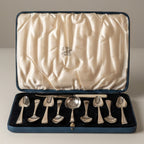 Atlas & Arden vintage sterling silver teaspoon and strainer set in a blue leather presentation case with silk lining.