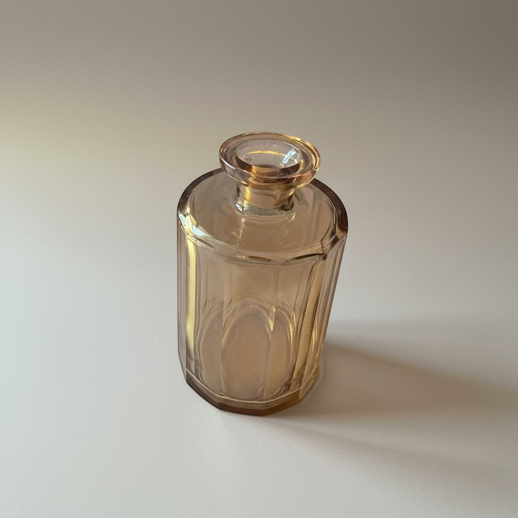 Atlas & Arden heavy cut amber glass vessel with paneled sides and faceted neck. Vintage Bohemian glass.