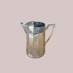 Atlas & Arden Art Deco silver plate cocktail pitcher with hinged ice guard, 1930s. Faceted design.