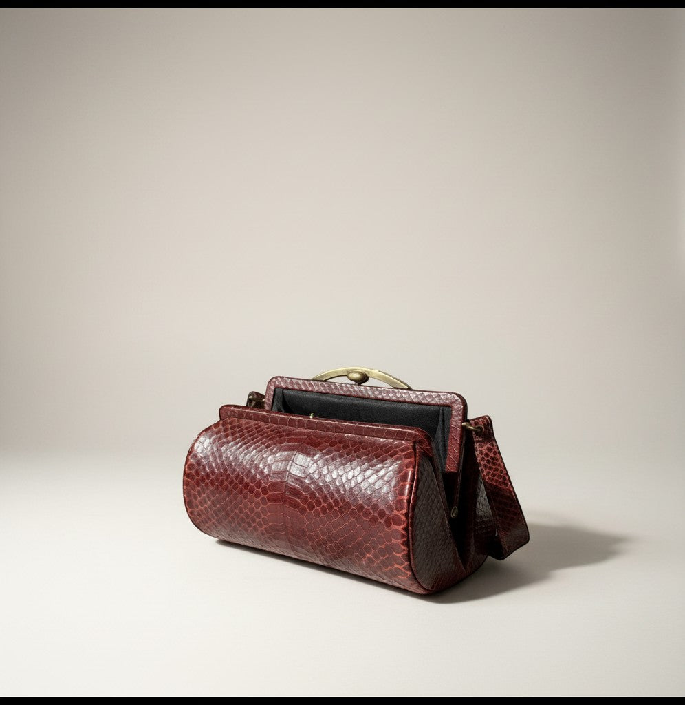 Atlas & Arden 1940s burgundy python snakeskin handbag with brass kiss-lock frame and interior change purse.