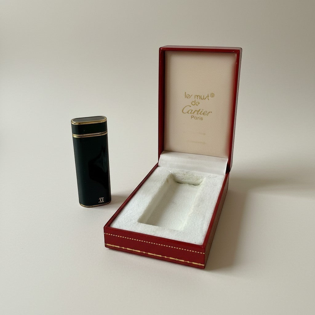 Atlas & Arden vintage Cartier Les Must lighter in navy lacquer with gold trim and double-C logo, with original red box.