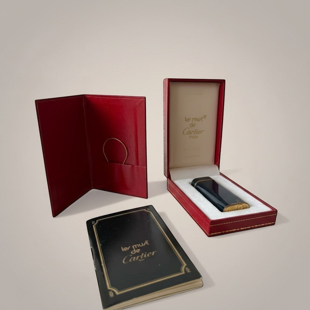 Atlas & Arden vintage Cartier Les Must lighter in navy lacquer with gold trim and double-C logo, in original red box with papers.