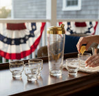 Atlas & Arden vintage Culver 22K gold Patriotic Eagle cocktail shaker set with six roly-poly glasses on a wooden tray.