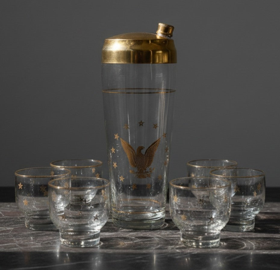 Atlas & Arden vintage Culver 22K gold Patriotic Eagle cocktail shaker set with six roly-poly glasses on marble table.