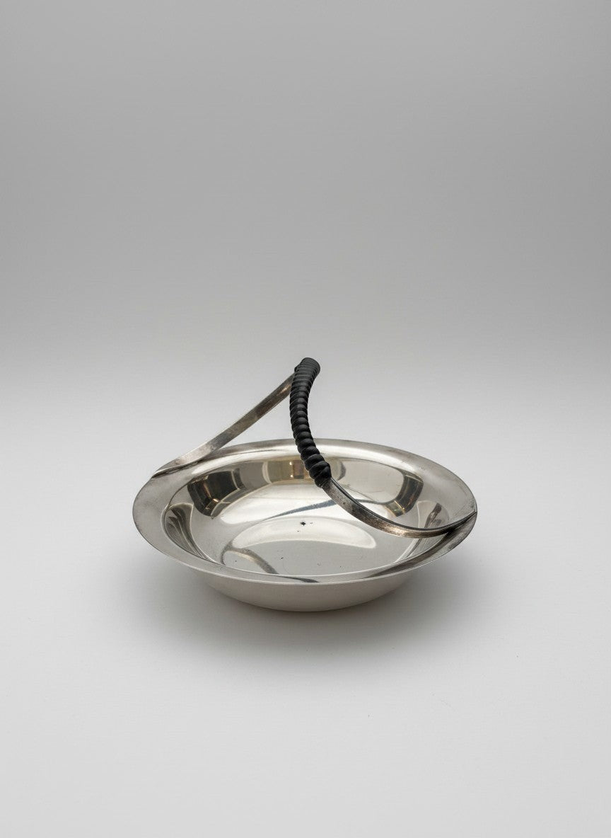 Atlas & Arden Danish silverplate catchall dish with black wrapped handle, mid-century design.