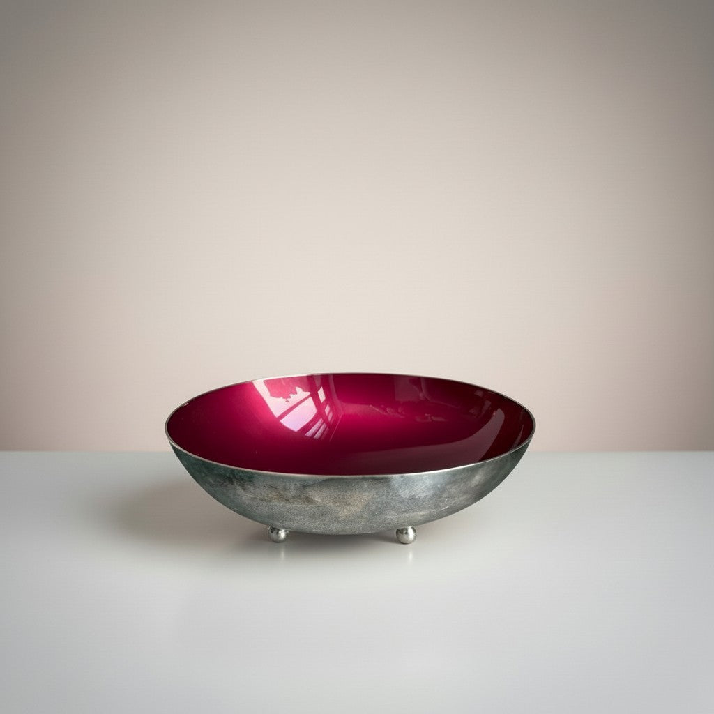 Atlas & Arden oval silverplate bowl with a glossy berry-wine enamel interior, raised on three ball feet. Mid-century design.