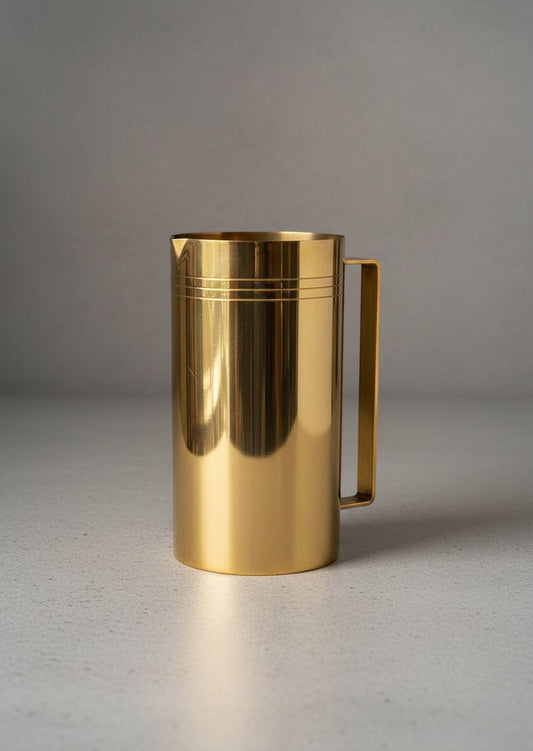 Atlas & Arden 1960s 24K gold-plated cylindrical pitcher with angular handle and incised triple-line banding.