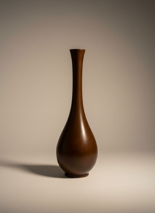 Atlas & Arden Japanese bronze tsuru-kubi bud vase, mid-20th century. Deep brown with reddish undertones and subtle vertical fluting.