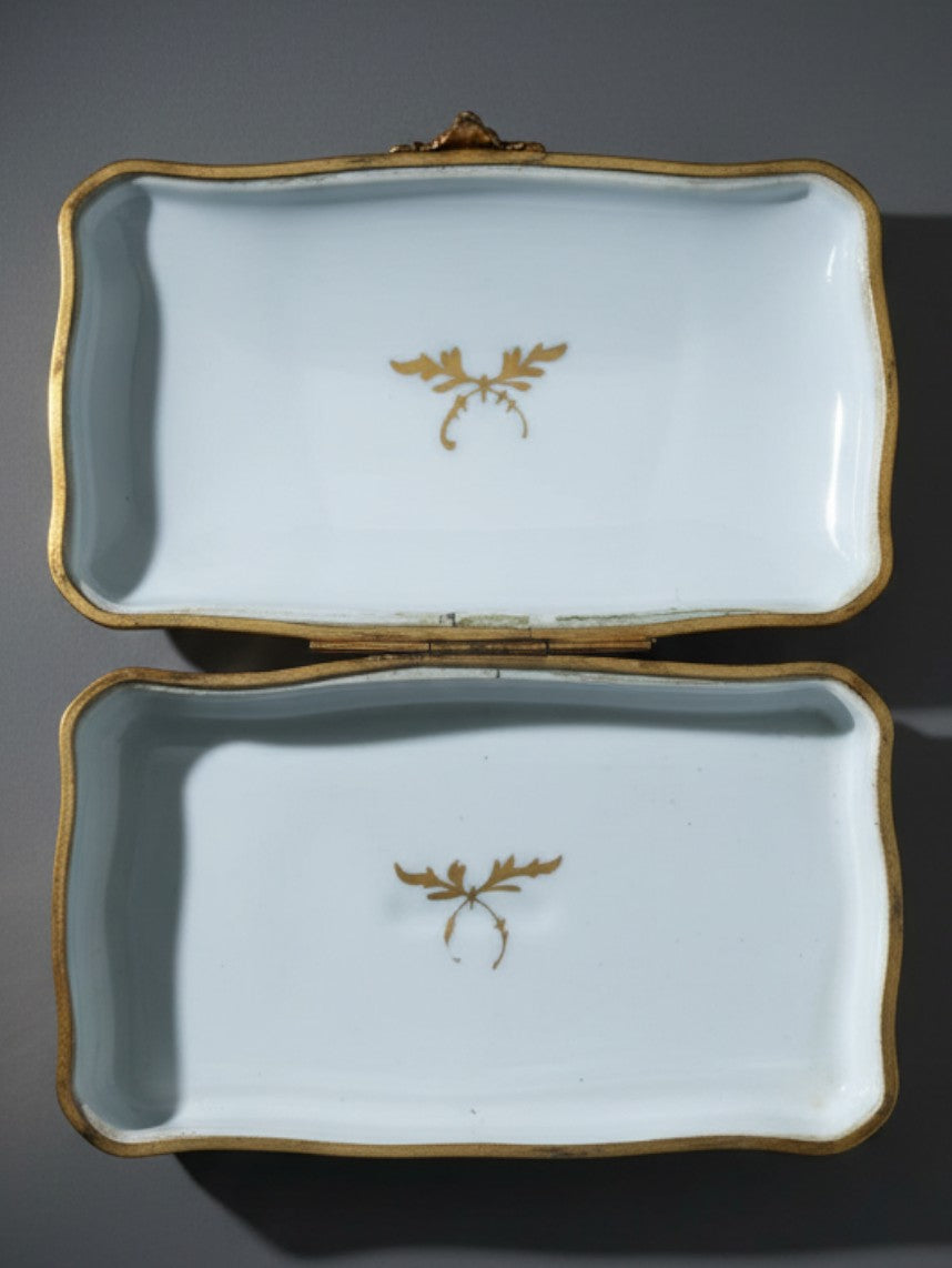 Atlas & Arden vintage Limoges porcelain box interior with gold gilt sprig decoration on a white glazed surface.