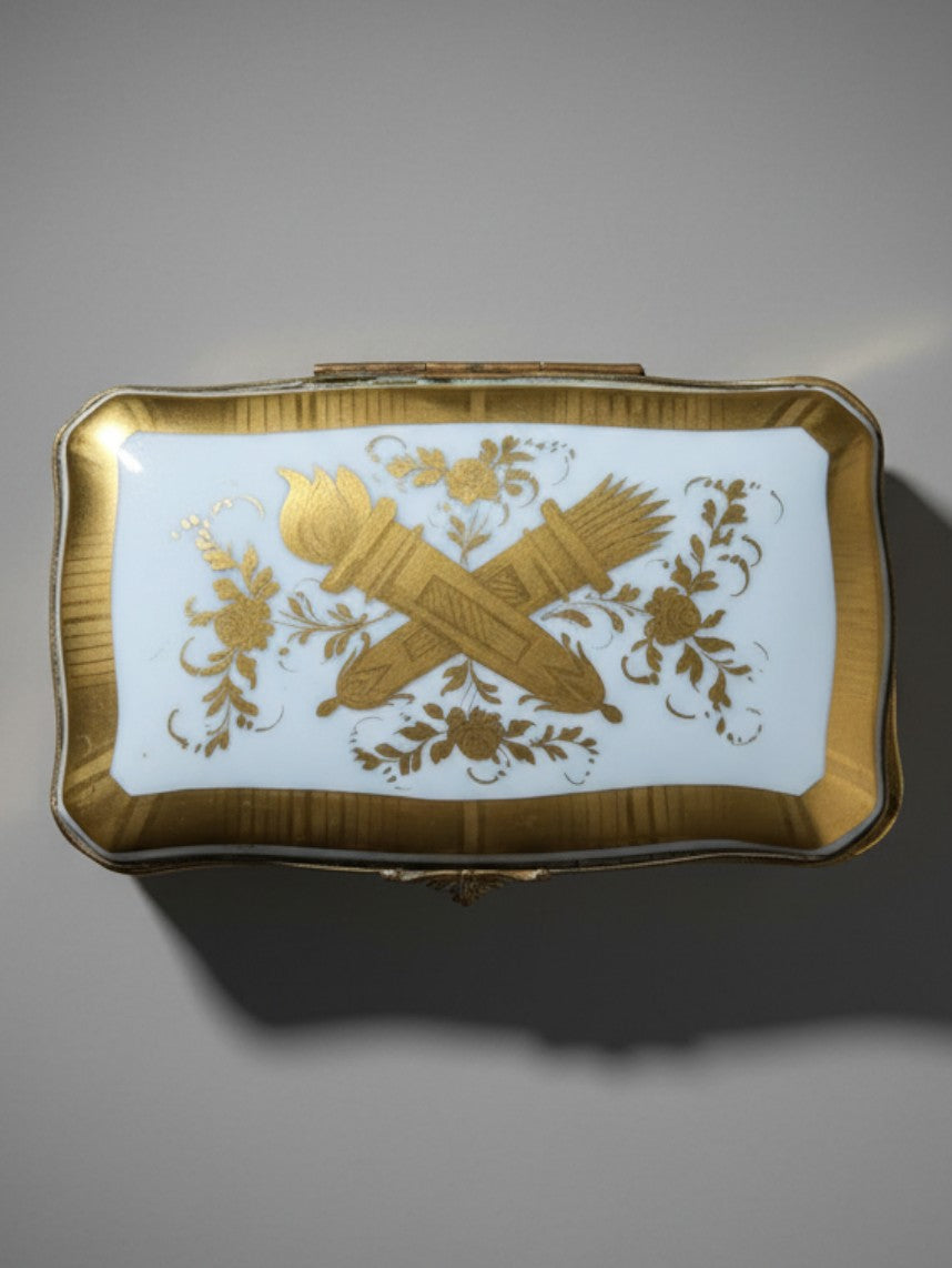Atlas & Arden vintage Limoges porcelain box featuring a gold gilt love trophy of a torch and quiver on the lid.
