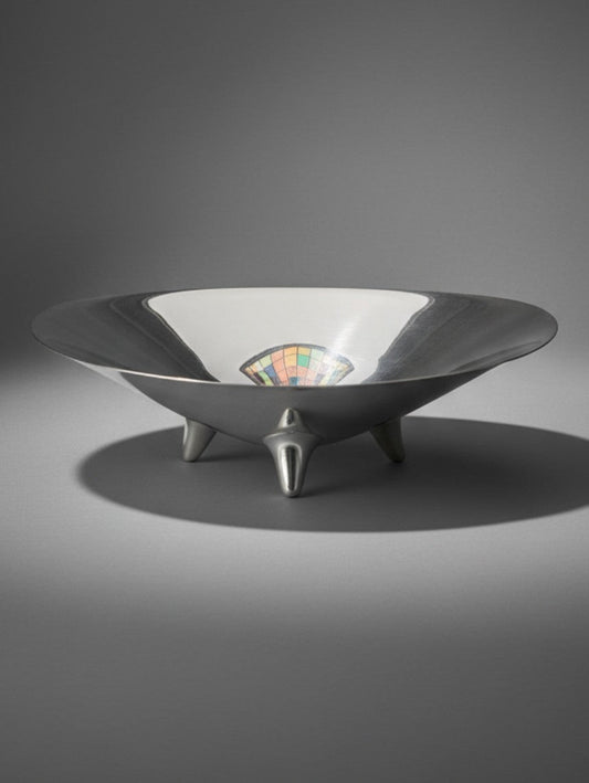 Atlas & Arden vintage Reed & Barton silverplate modernist footed bowl with three teardrop feet on a grey background.