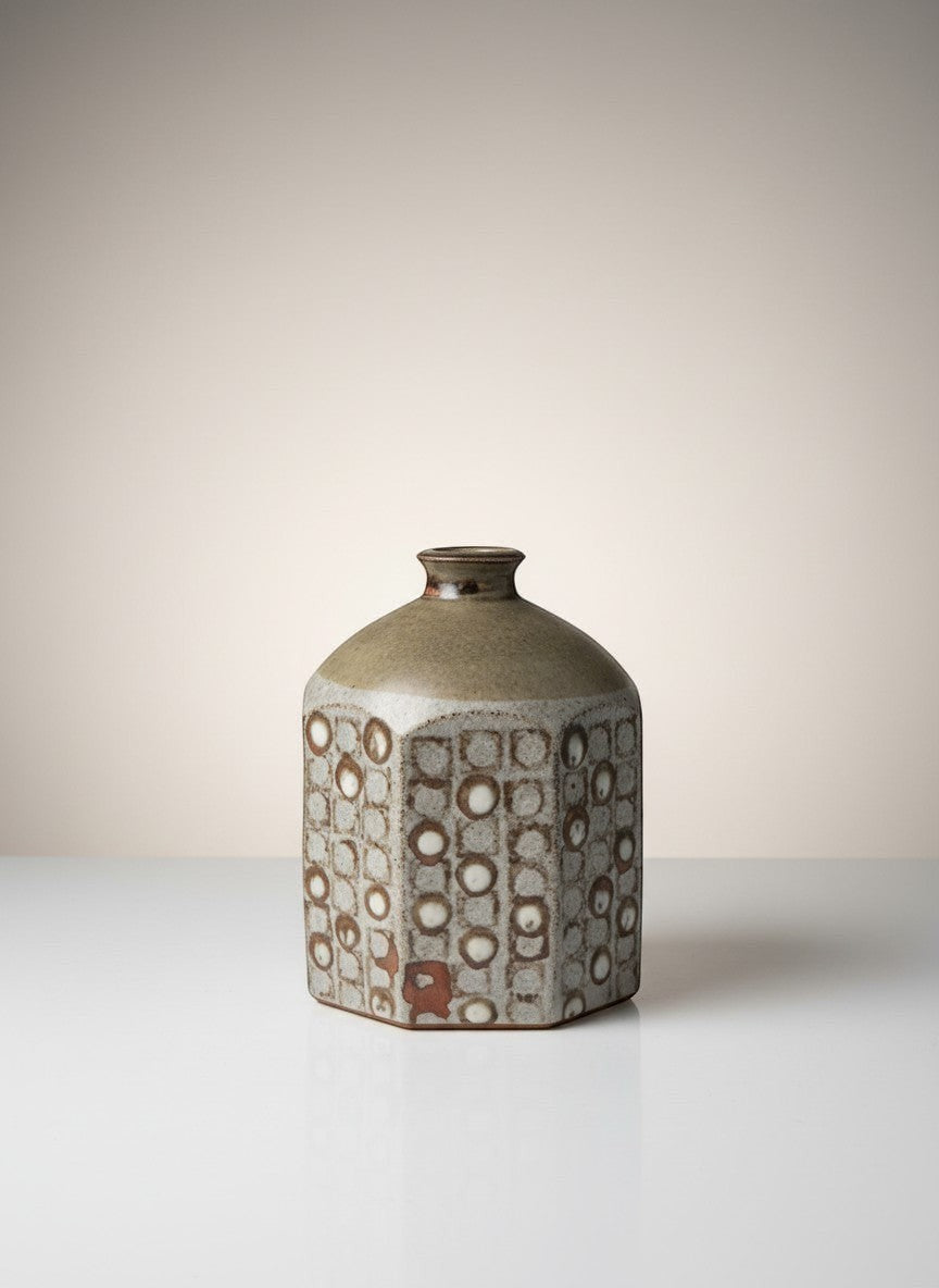 Atlas & Arden signed studio stoneware bottle vase by Westerberg. Octagonal ash-toned vase with impressed circle pattern and narrow neck.