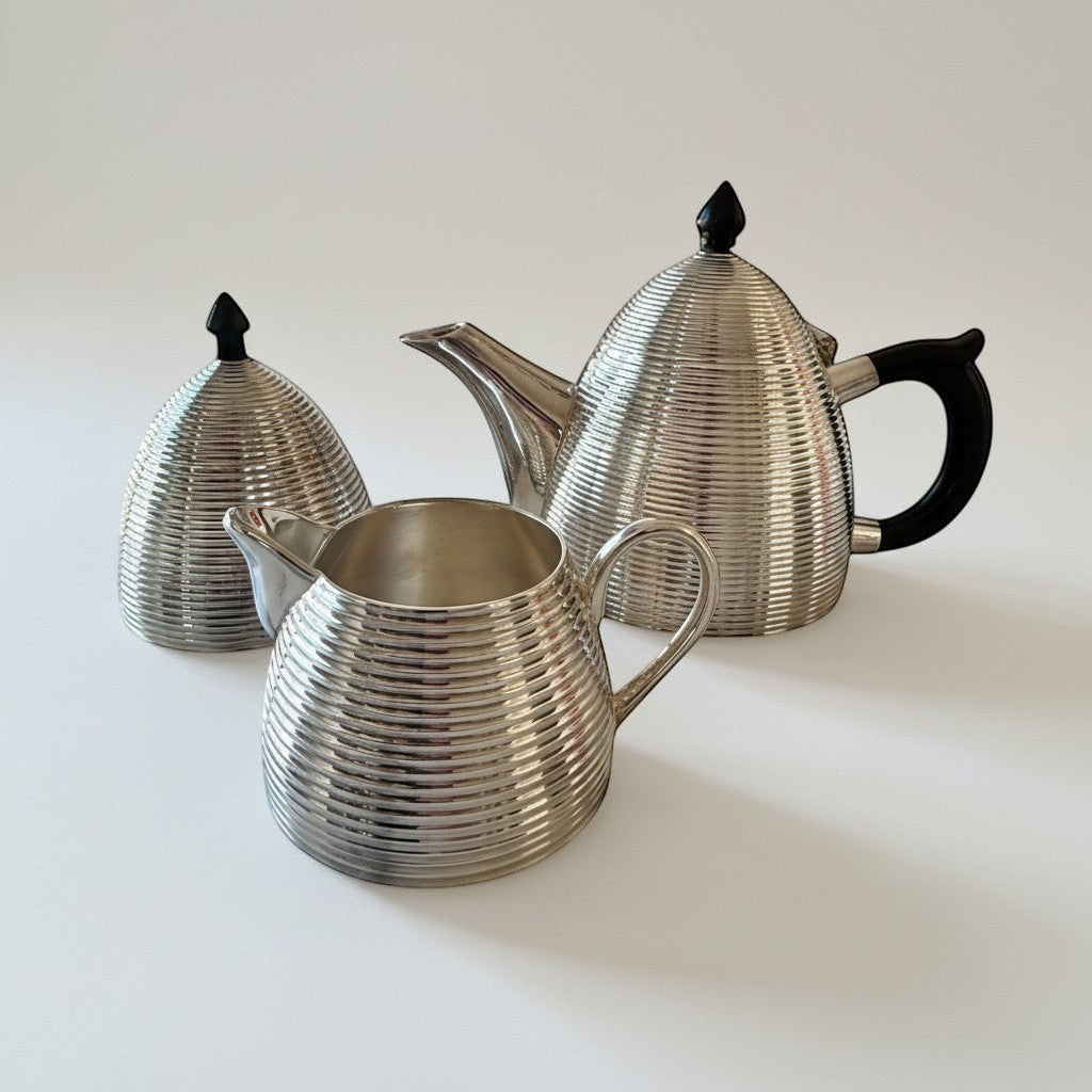 Atlas & Arden silver-plated beehive tea set with ribbed pattern and black Bakelite handle and finials.