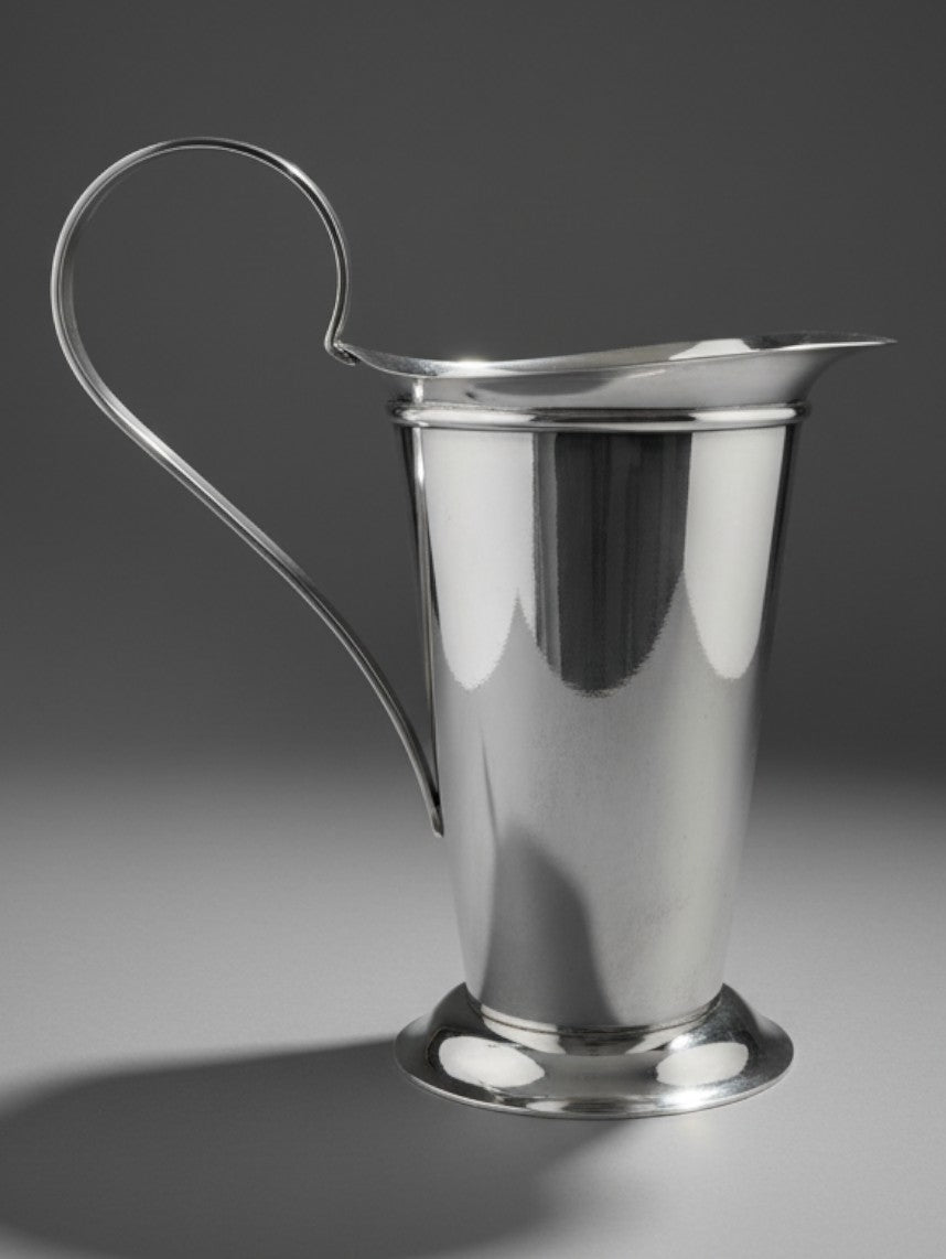 Atlas & Arden silverplate pitcher by Robert A.M. Stern for Swid Powell, featuring a Doric column design and scroll handle