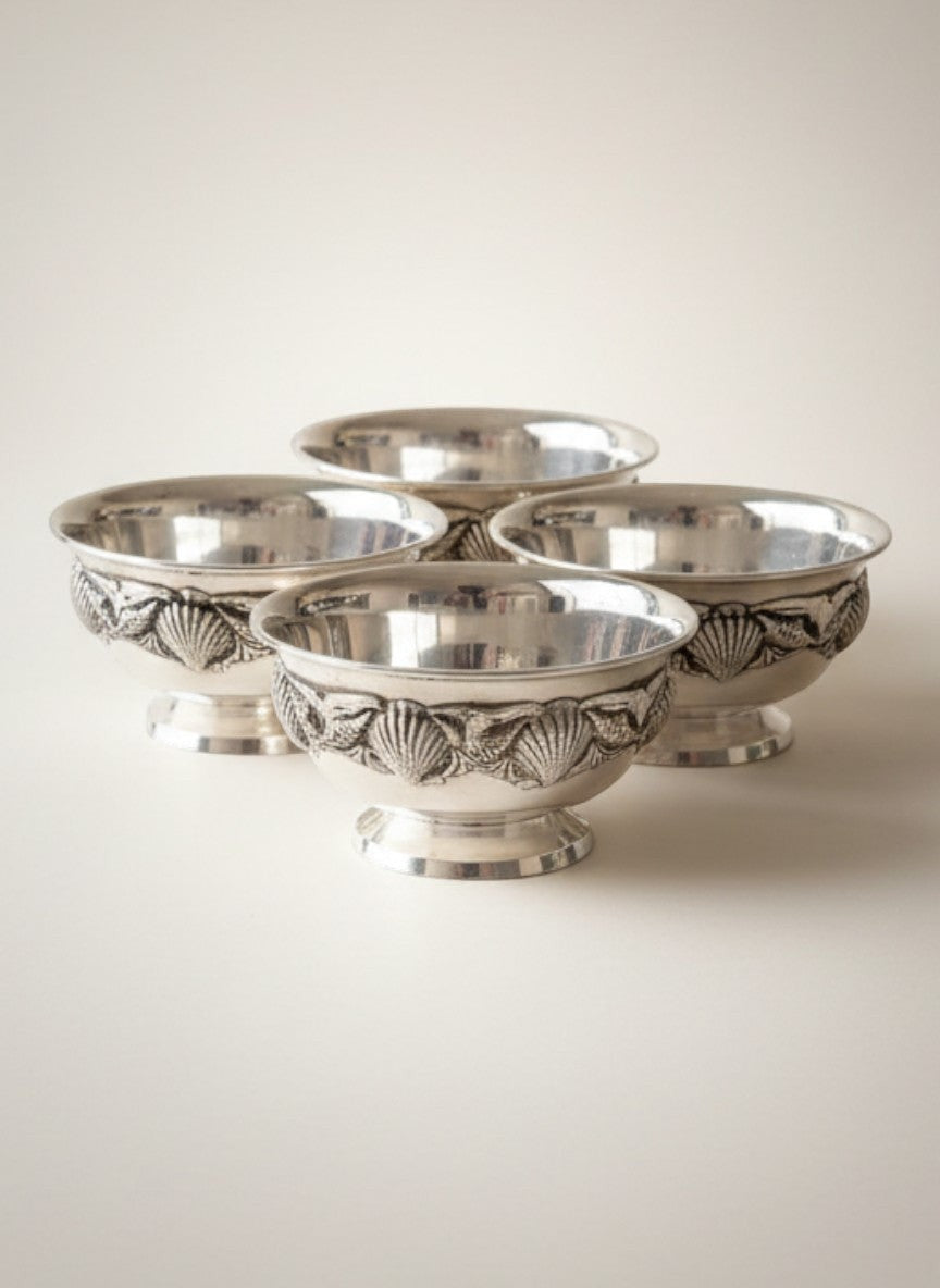 Atlas & Arden set of four silverplate footed bowls with applied shell border, mid-century style.