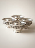 Atlas & Arden set of four silverplate footed bowls with applied shell border, mid-century style.