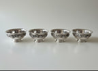 Atlas & Arden set of four silverplate footed bowls with applied shell border, mid-century style.