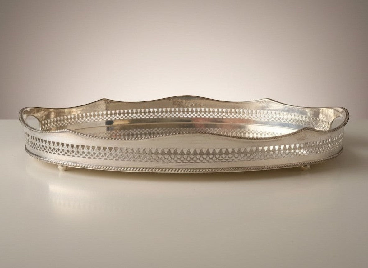 Atlas & Arden oval silverplate gallery tray with pierced rail, scalloped edge, beaded rim, cut-out handles, and ball feet.