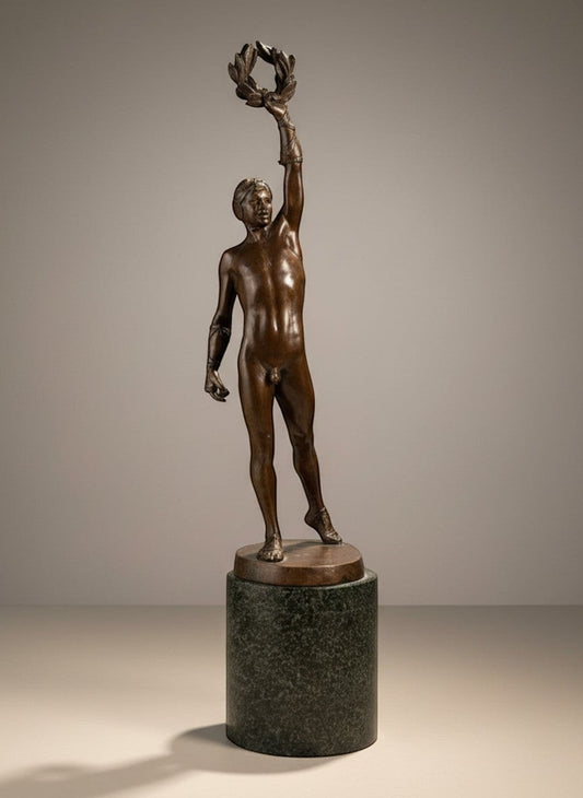 Atlas & Arden Patinated bronze figure of a victorious athlete holding a laurel wreath aloft, on a marble base.