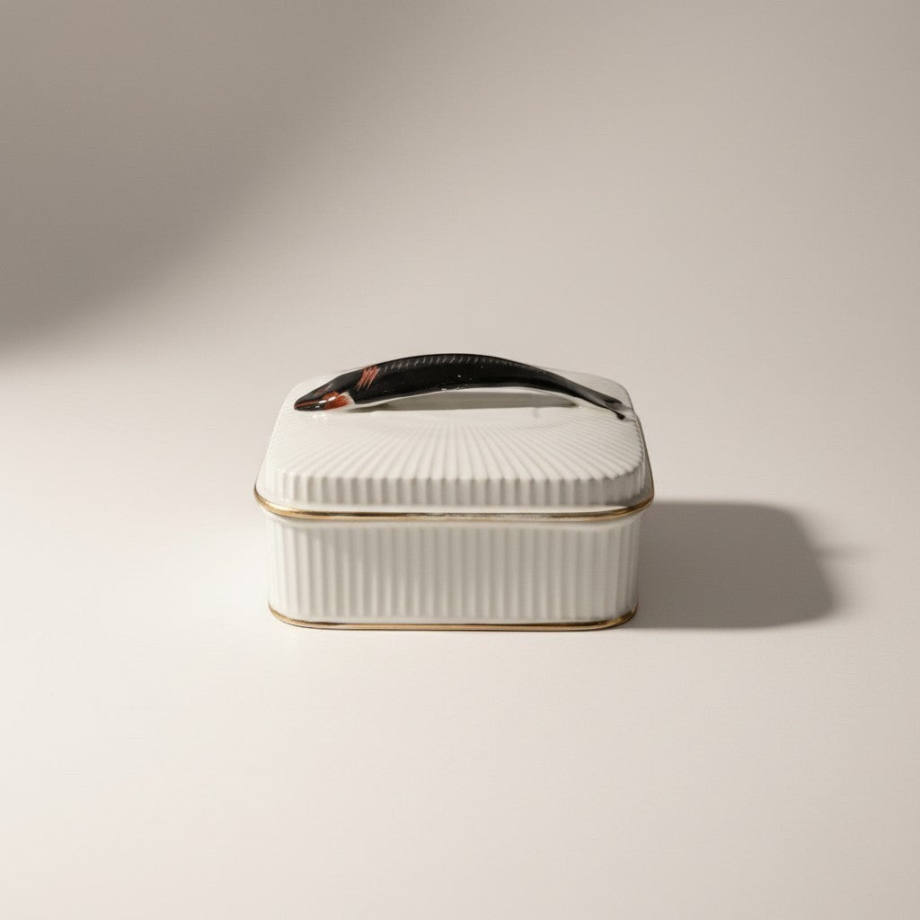 Atlas & Arden mid-century white ribbed porcelain sardine box with gold trim and a black fish handle.
