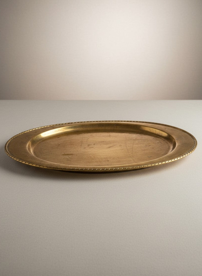 Atlas & Arden Ystad Metall oval brass serving platter with hand-hammered surface and twisted rope rim, mid-century Swedish design.
