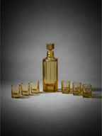 Detail of the faceted amber crystal and architectural geometric form of the bar set.