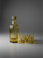 Amber crystal decanter with six matching cordials, mid-twentieth century bar set.